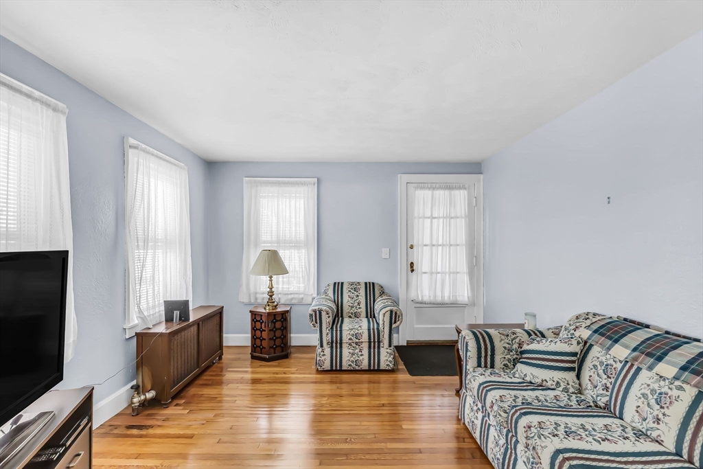 44 Cherrelyn Street Springfield, MA 01104 - Photo 9 of 36 a living room with furniture and a flat screen tv