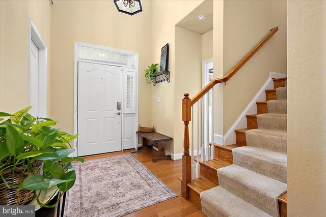 a bathroom with a double vanity sink mirror and bathtub