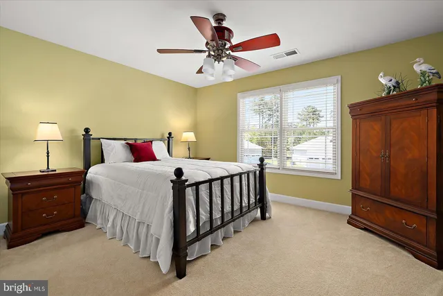 an aerial view of a house with a garden and lake view