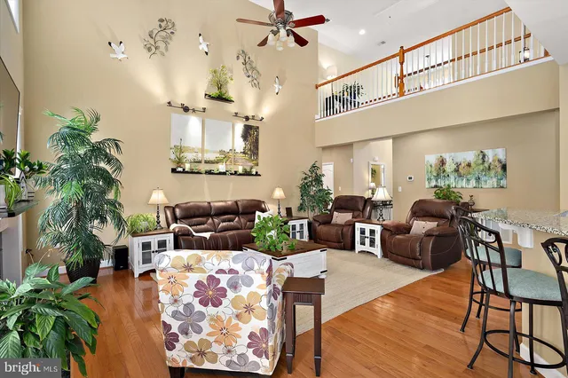 a spacious bedroom with a bed and a chandelier