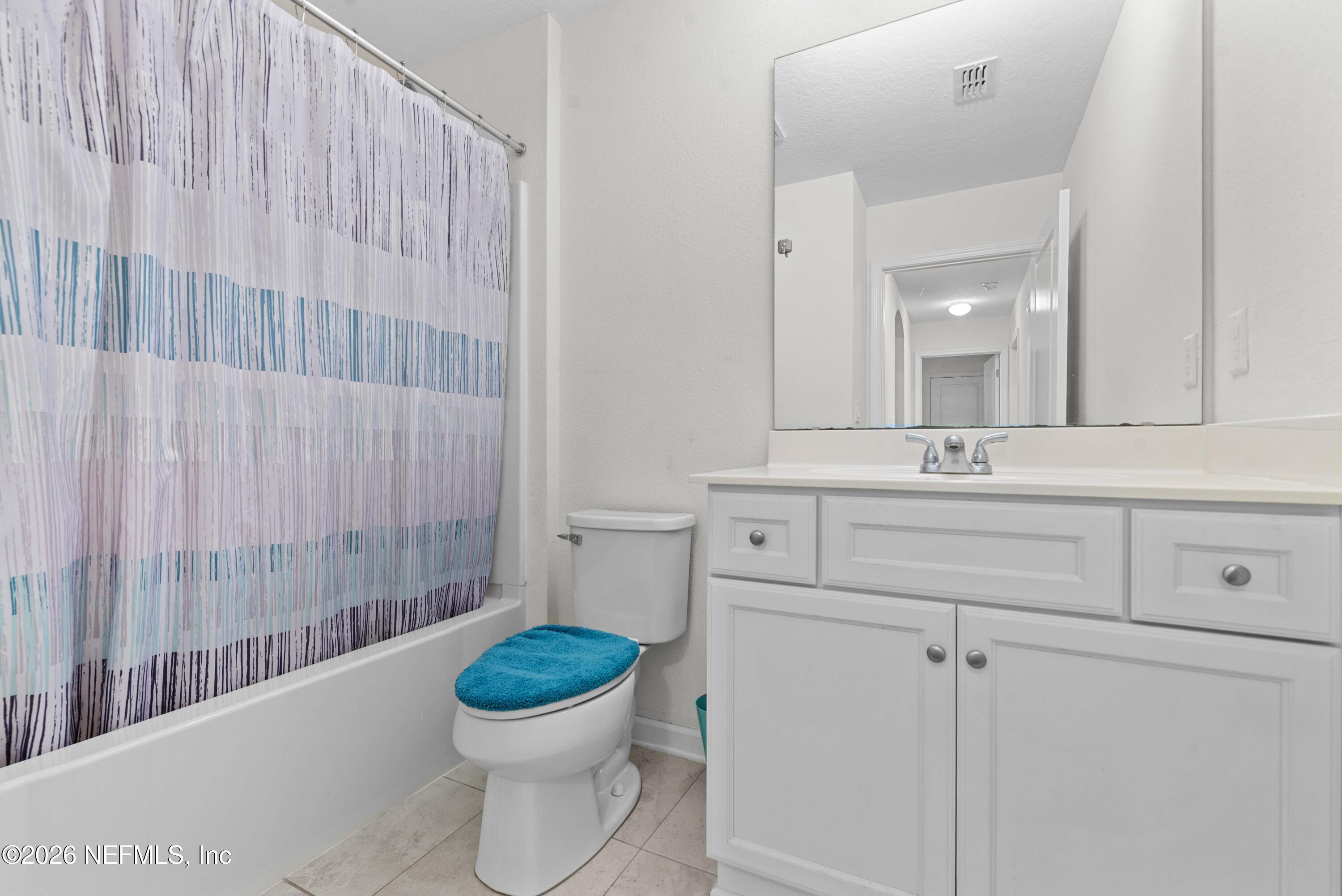 9862 Soldier Court Jacksonville, FL 32221 - Photo 21 of 30 a bathroom with a sink a toilet and a mirror