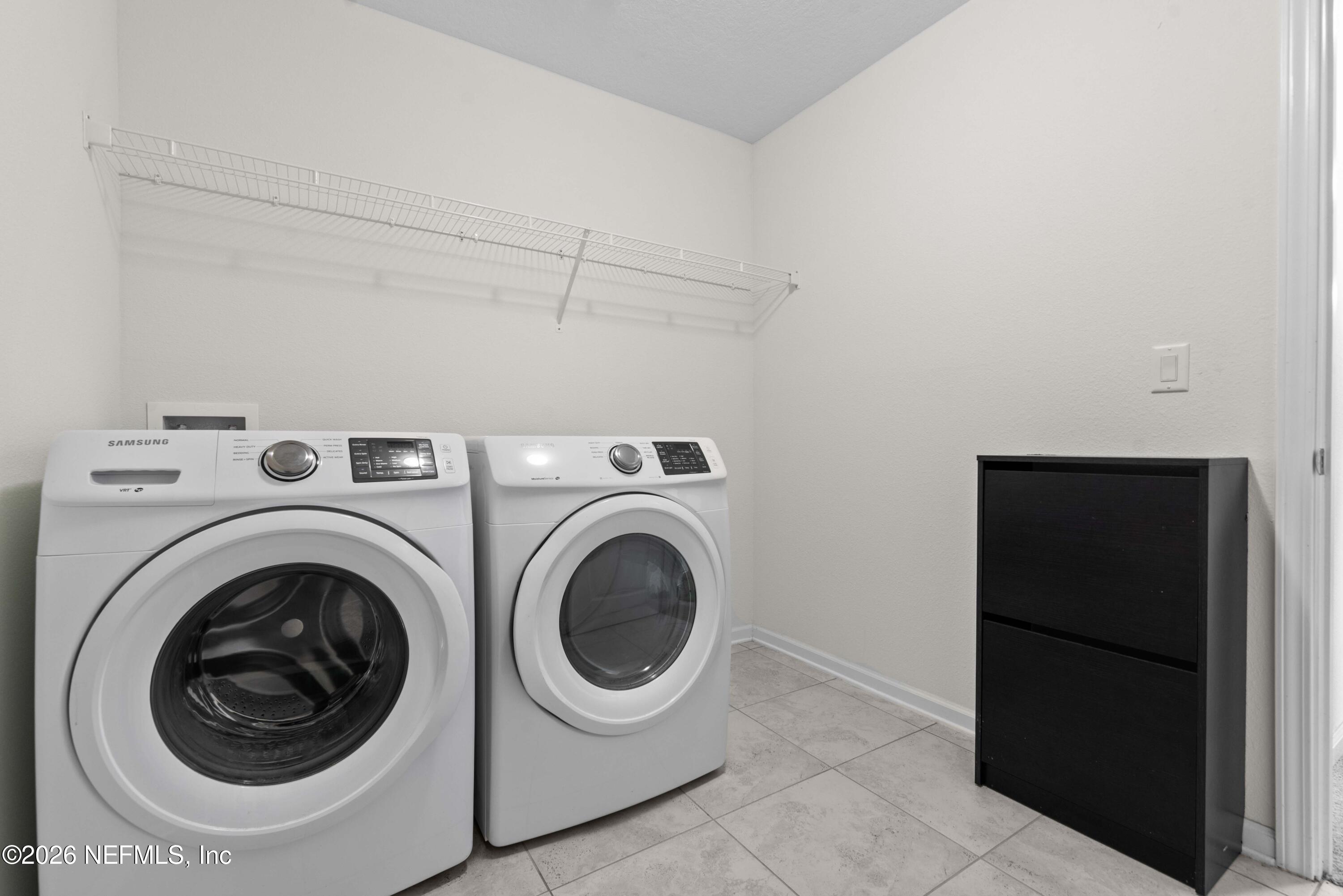 9862 Soldier Court Jacksonville, FL 32221 - Photo 24 of 30 a utility room with dryer and washer