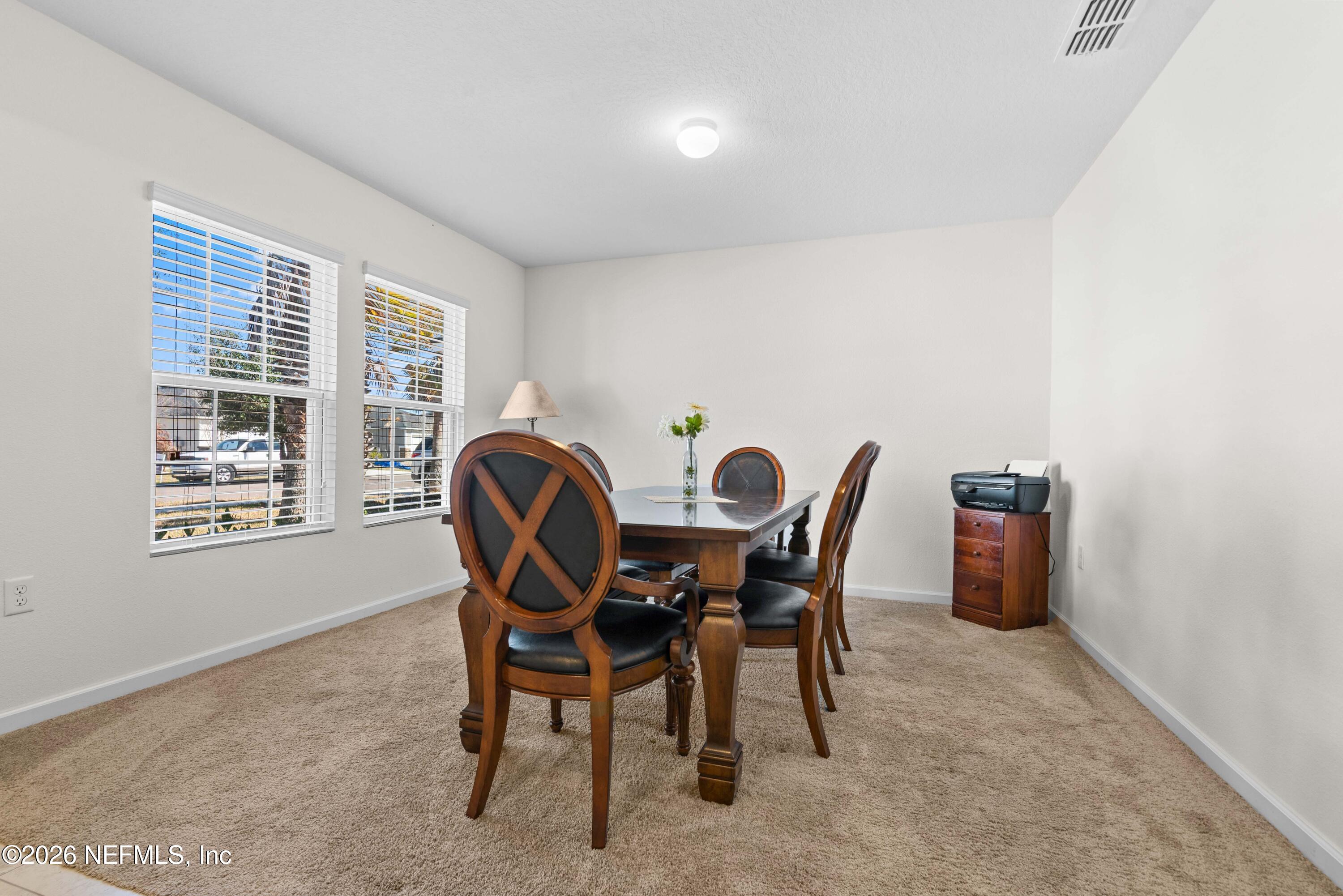9862 Soldier Court Jacksonville, FL 32221 - Photo 5 of 30 a dining room with furniture and window