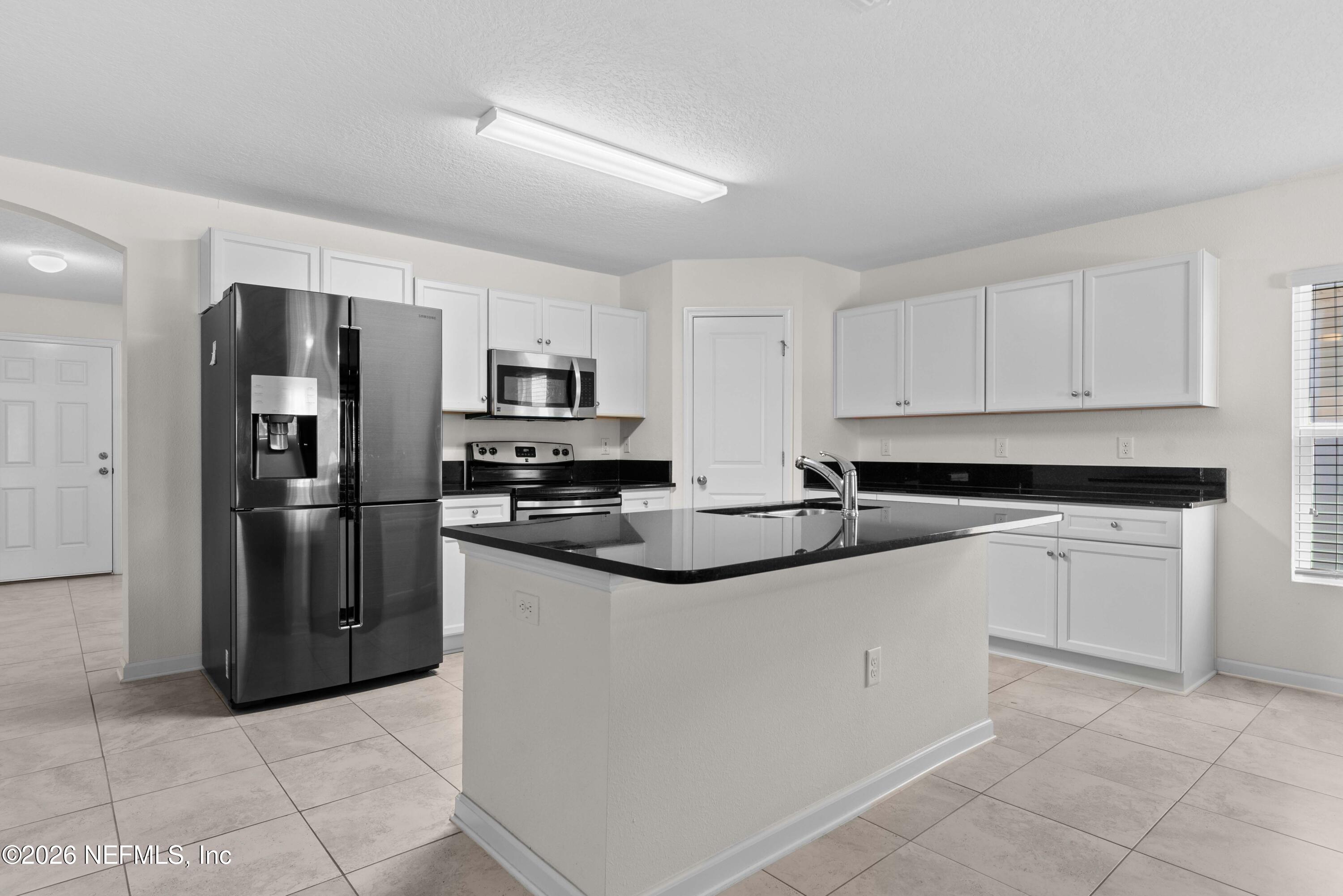 9862 Soldier Court Jacksonville, FL 32221 - Photo 8 of 30 a kitchen with stainless steel appliances granite countertop a refrigerator and a sink