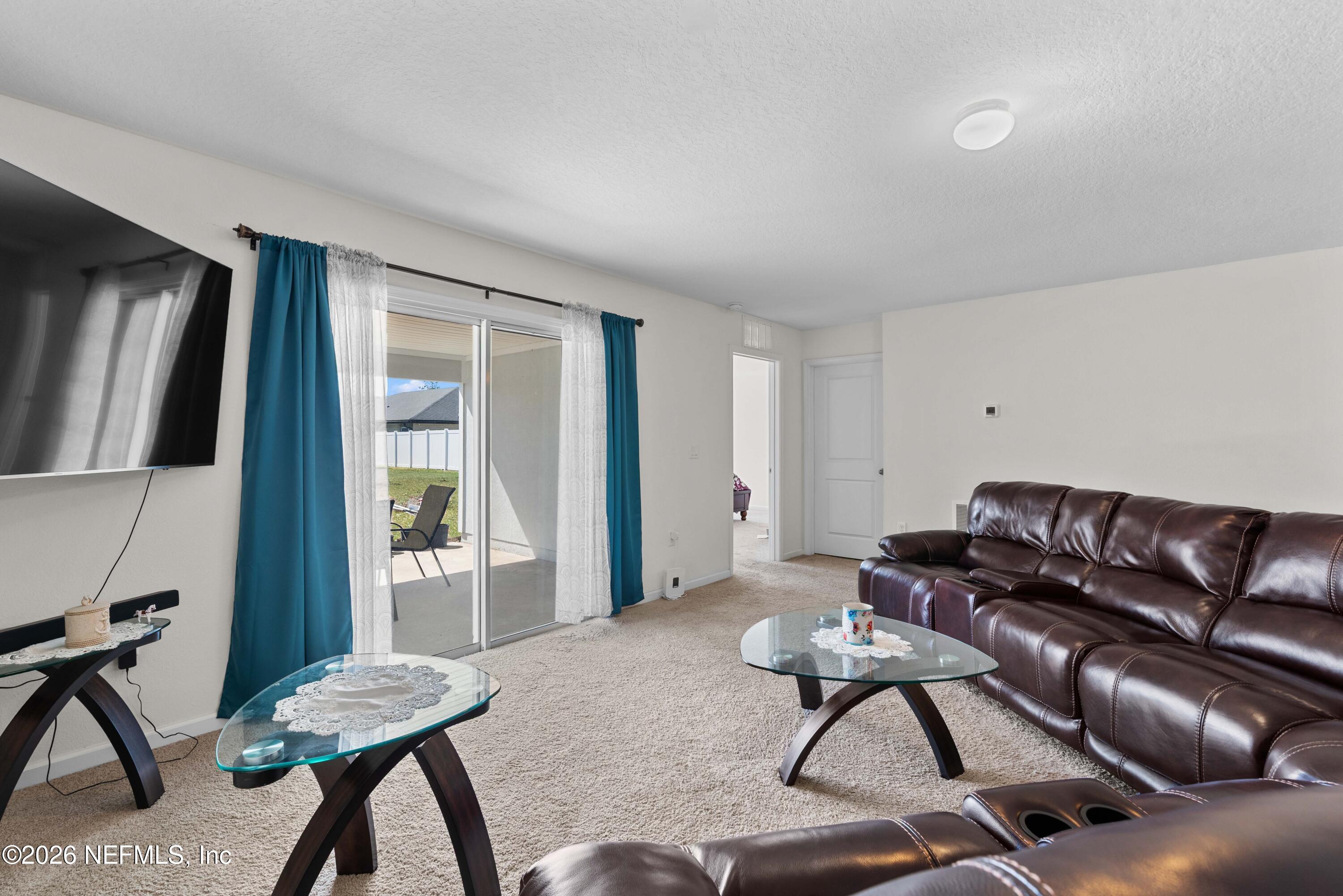 9862 Soldier Court Jacksonville, FL 32221 - Photo 9 of 30 a living room with furniture and a window