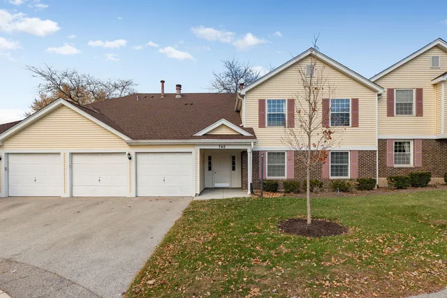 a view of a yard in front view of a house
