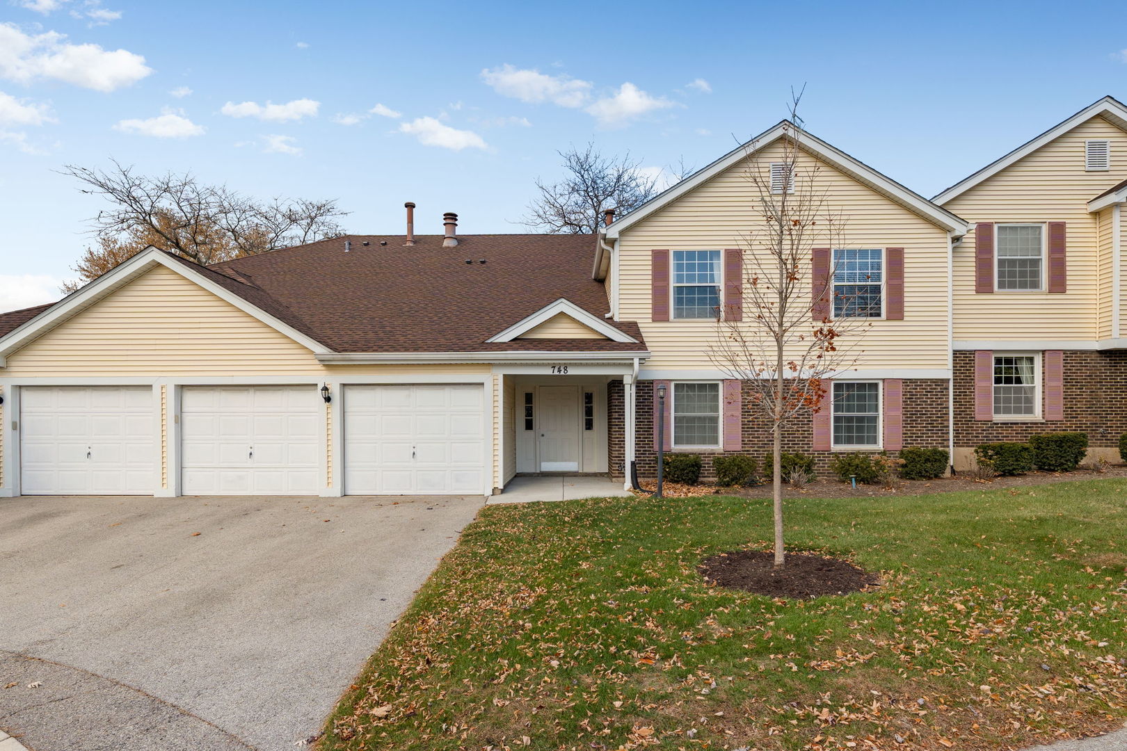 a view of a yard in front view of a house