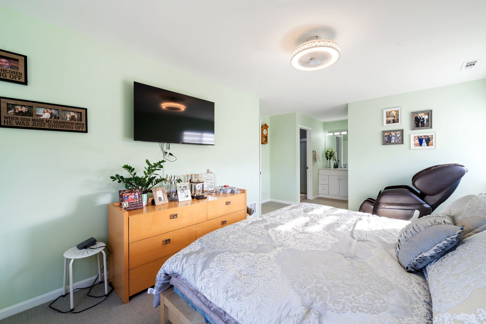 748 Sterling Court, Unit A2 Bartlett, IL 60103 - Photo 11 of 27 a bedroom with furniture and a flat screen tv