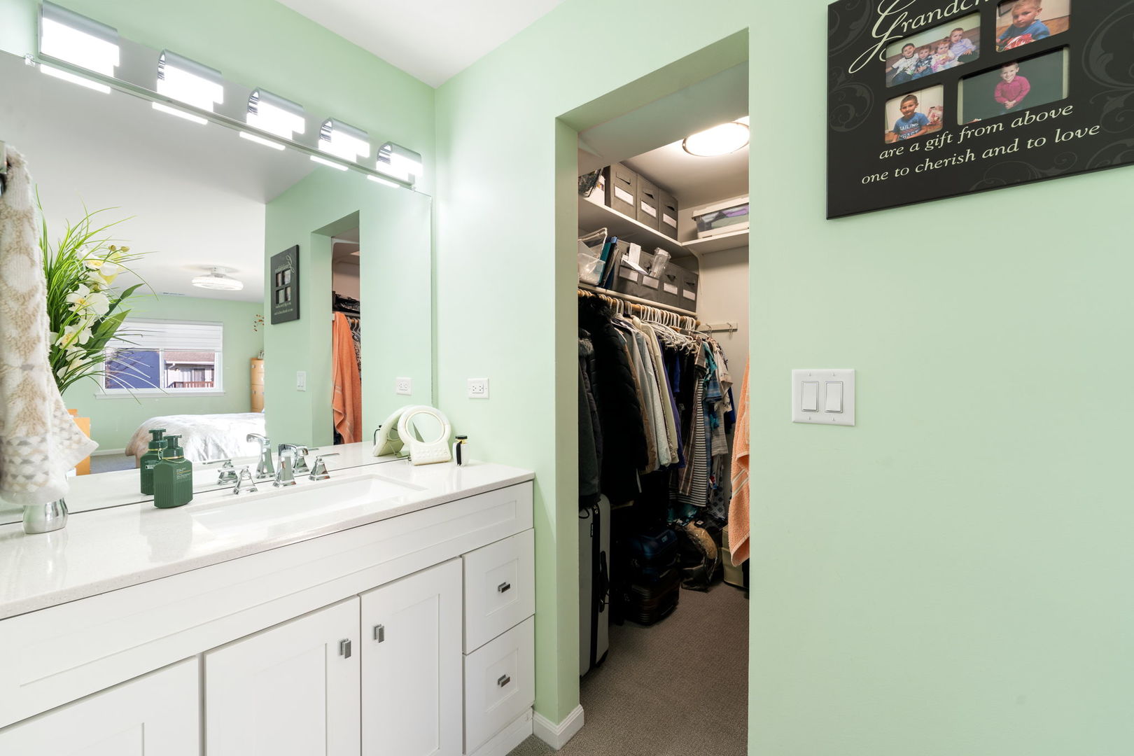 748 Sterling Court, Unit A2 Bartlett, IL 60103 - Photo 14 of 27 a bathroom with a sink and a mirror