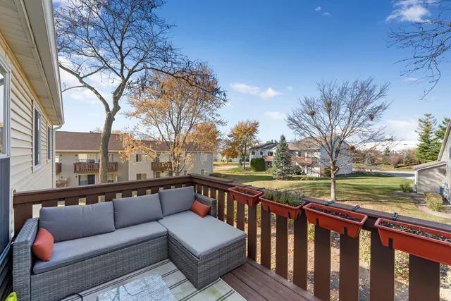 a view of a two chairs on the roof deck