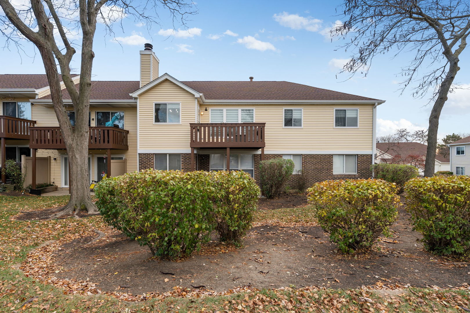 748 Sterling Court, Unit A2 Bartlett, IL 60103 - Photo 23 of 27 a front view of a house with garden