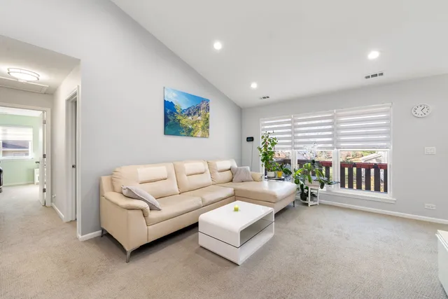 a living room with furniture and windows