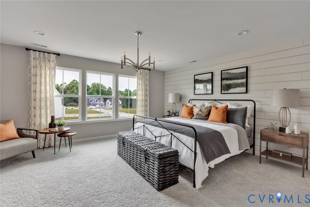 925 Charlemagne Road Midlothian, VA 23114 - Photo 20 of 43 a spacious bedroom with a bed and a couch