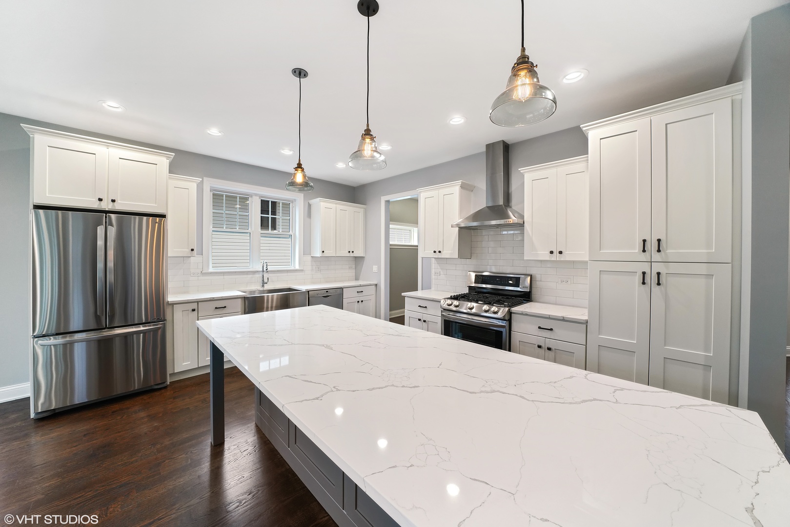 1205 Ridge Road Westmont, IL 60527 - Photo 9 of 16 a kitchen with stainless steel appliances granite countertop a refrigerator a sink dishwasher a stove and white cabinets with wooden floor