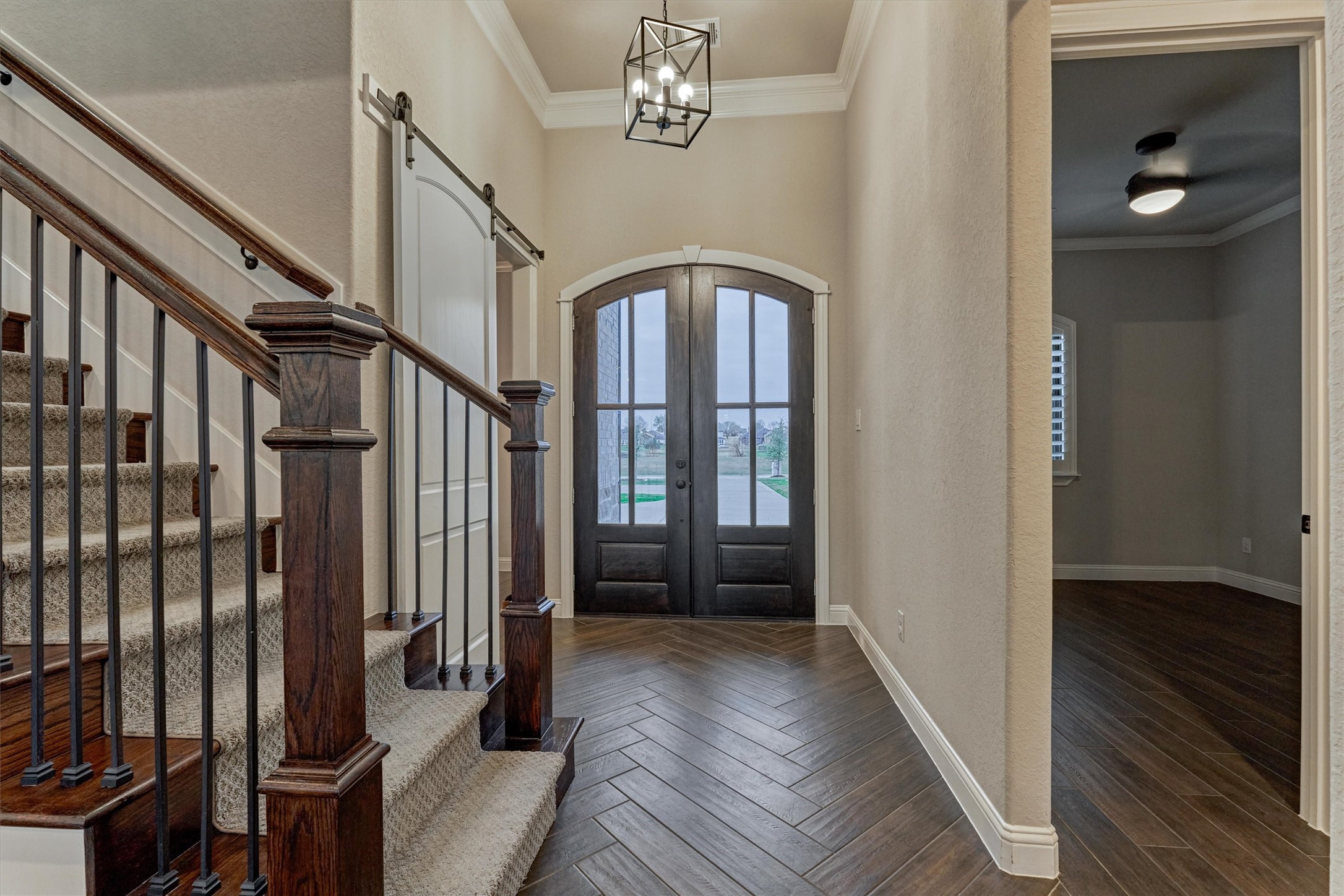 11618 Renaissance Drive Montgomery, TX 77356 - Photo 5 of 49 Stained, arched-top double wood doors create a grand front entry. To the left is a private home office, while a hallway to the right leads to the guest bedrooms.