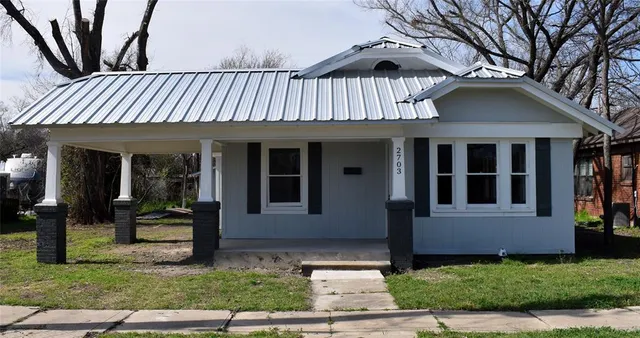 a front view of a house with a porch