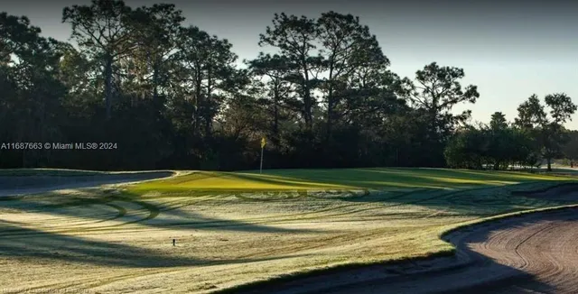 a view of a golf course with a lake