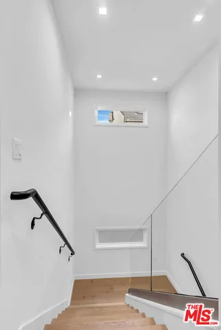 a view of a hallway with staircase