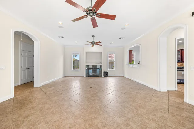 a kitchen with stainless steel appliances granite countertop a refrigerator a stove a sink and a microwave