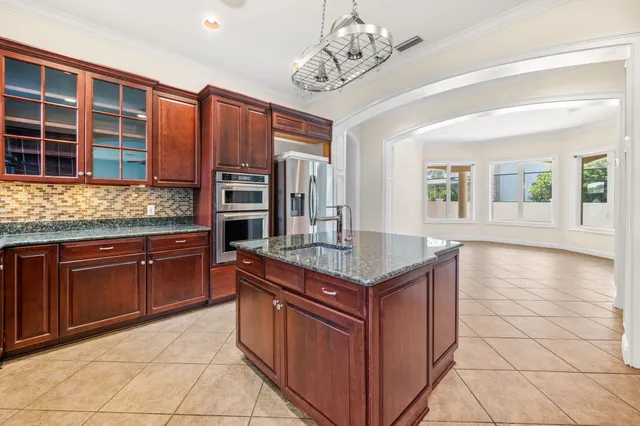 a view of a hallway with wooden floor and front door