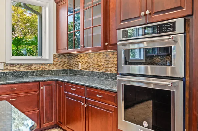 a view of a livingroom with a ceiling fan and window