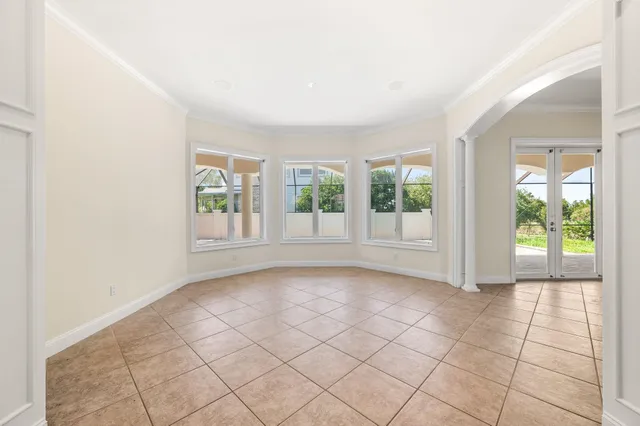 a view of a livingroom with a ceiling fan and window