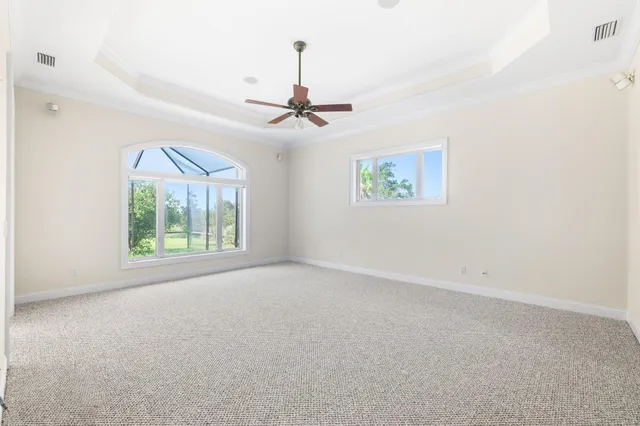 a bathroom with a granite countertop sink mirror bathtub and toilet