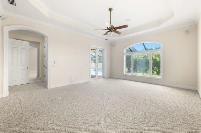 a bathroom with a granite countertop sink and mirror with bathtub