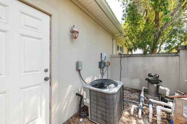 a house view with swimming pool