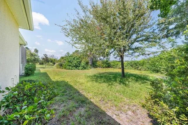a view of a backyard of the house