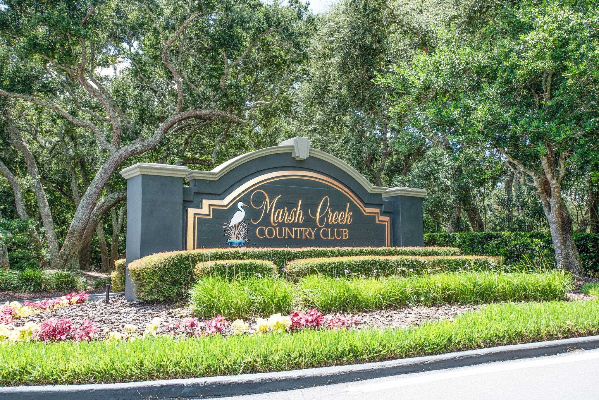 308 Marsh Point Circle St. Augustine, FL 32080 - Photo 54 of 61 a front view of a house with a garden