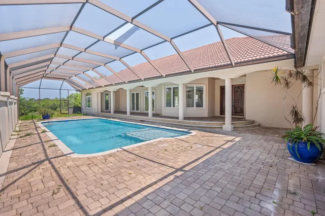 a view of a backyard with plants and a garden