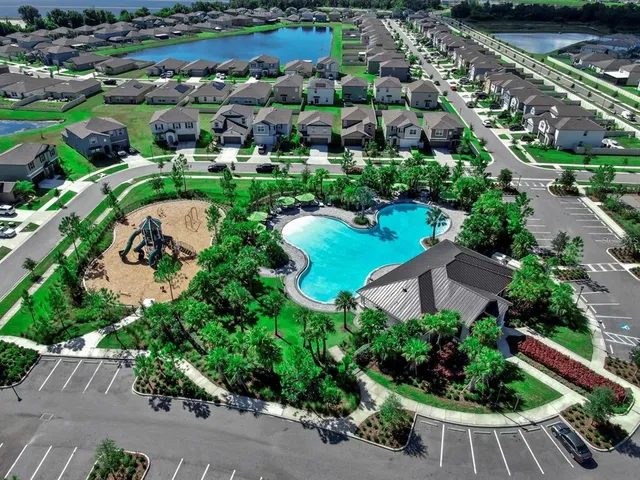 a swimming pool with outdoor seating