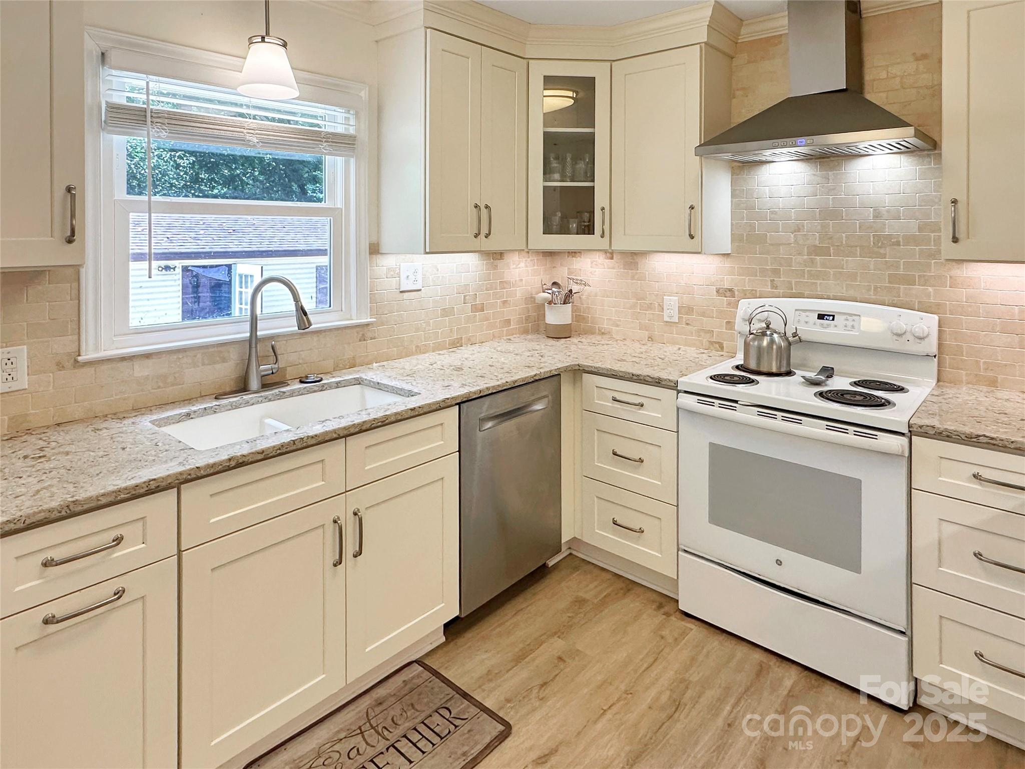 3245 15th Street Northeast Hickory, NC 28601 - Photo 12 of 39 a kitchen with granite countertop white cabinets and white appliances