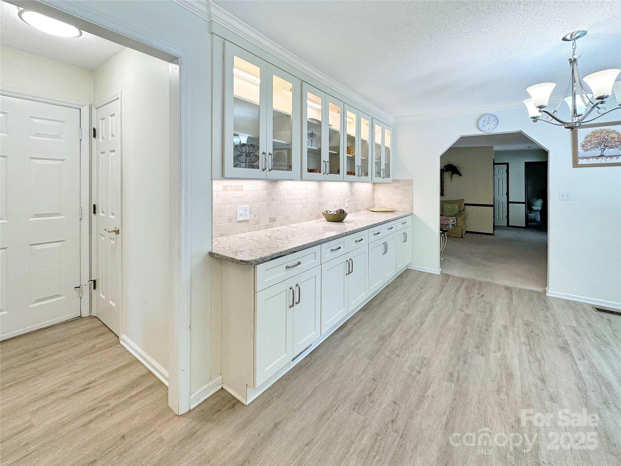 3245 15th Street Northeast Hickory, NC 28601 - Photo 15 of 39 a kitchen with a sink and a large mirror