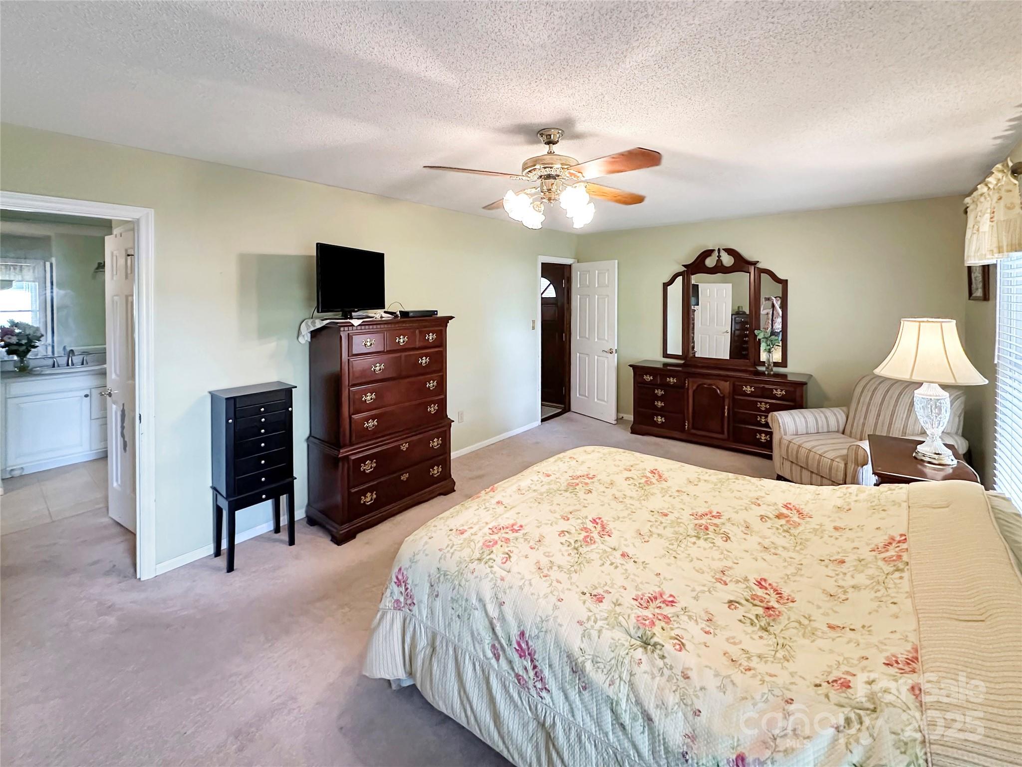 3245 15th Street Northeast Hickory, NC 28601 - Photo 17 of 39 a bedroom with a bed and a television