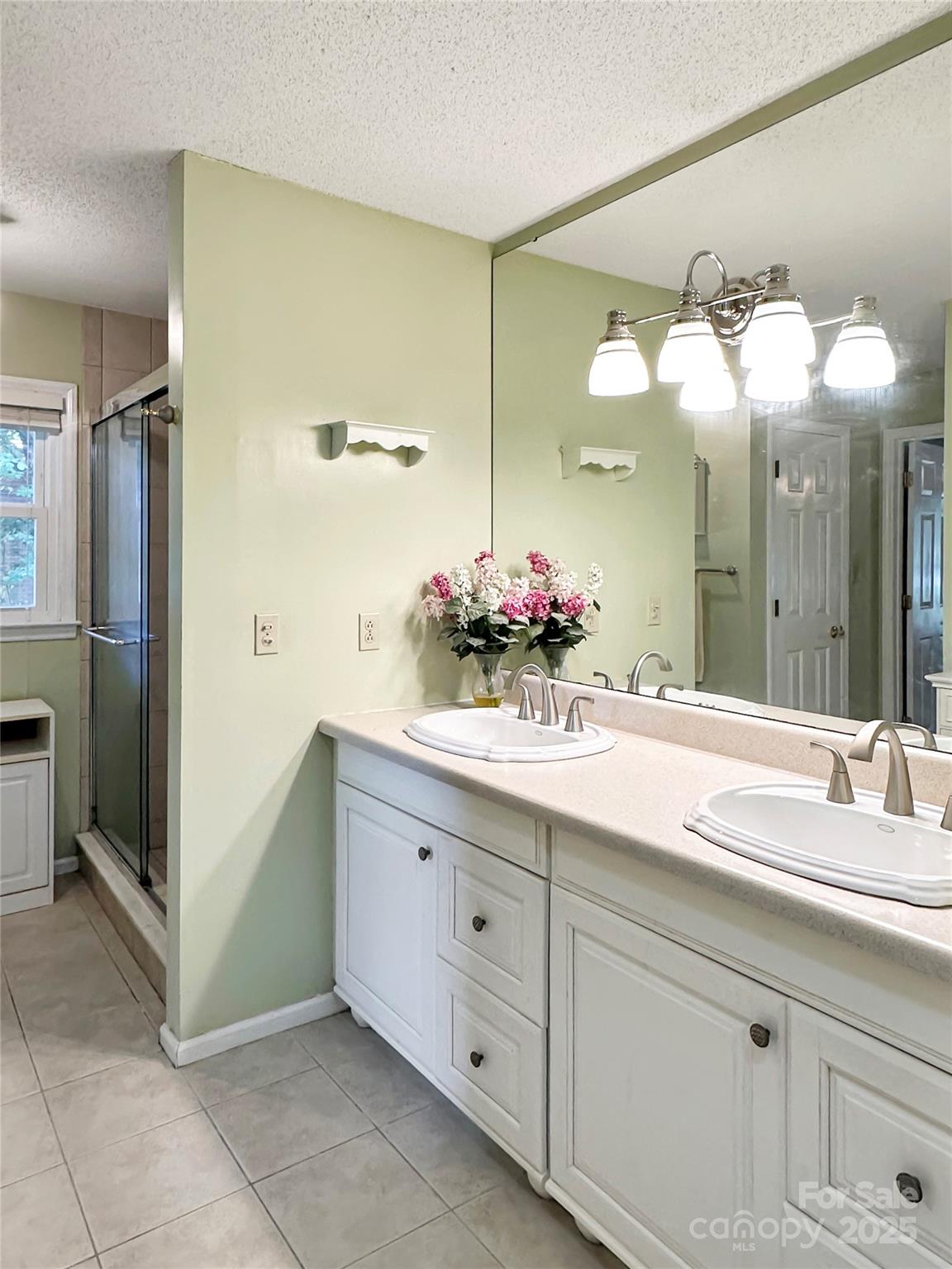 3245 15th Street Northeast Hickory, NC 28601 - Photo 19 of 39 a bathroom with a sink vanity and a mirror