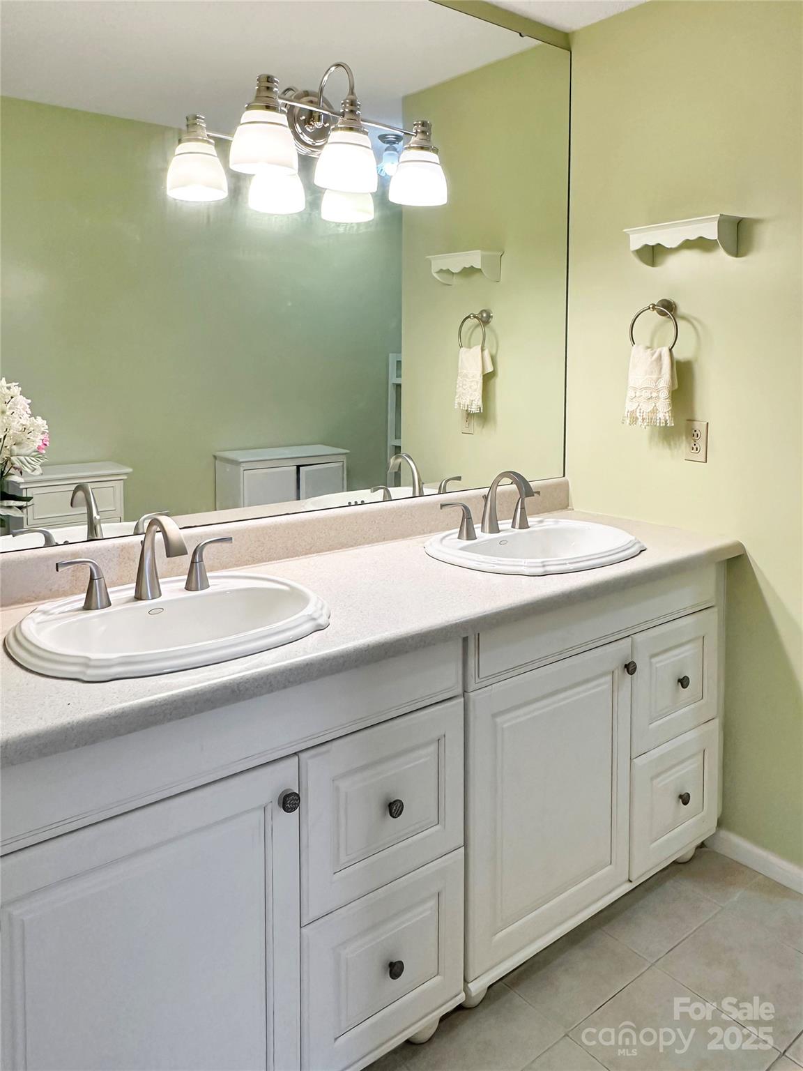 3245 15th Street Northeast Hickory, NC 28601 - Photo 20 of 39 a bathroom with a sink double vanity and a mirror