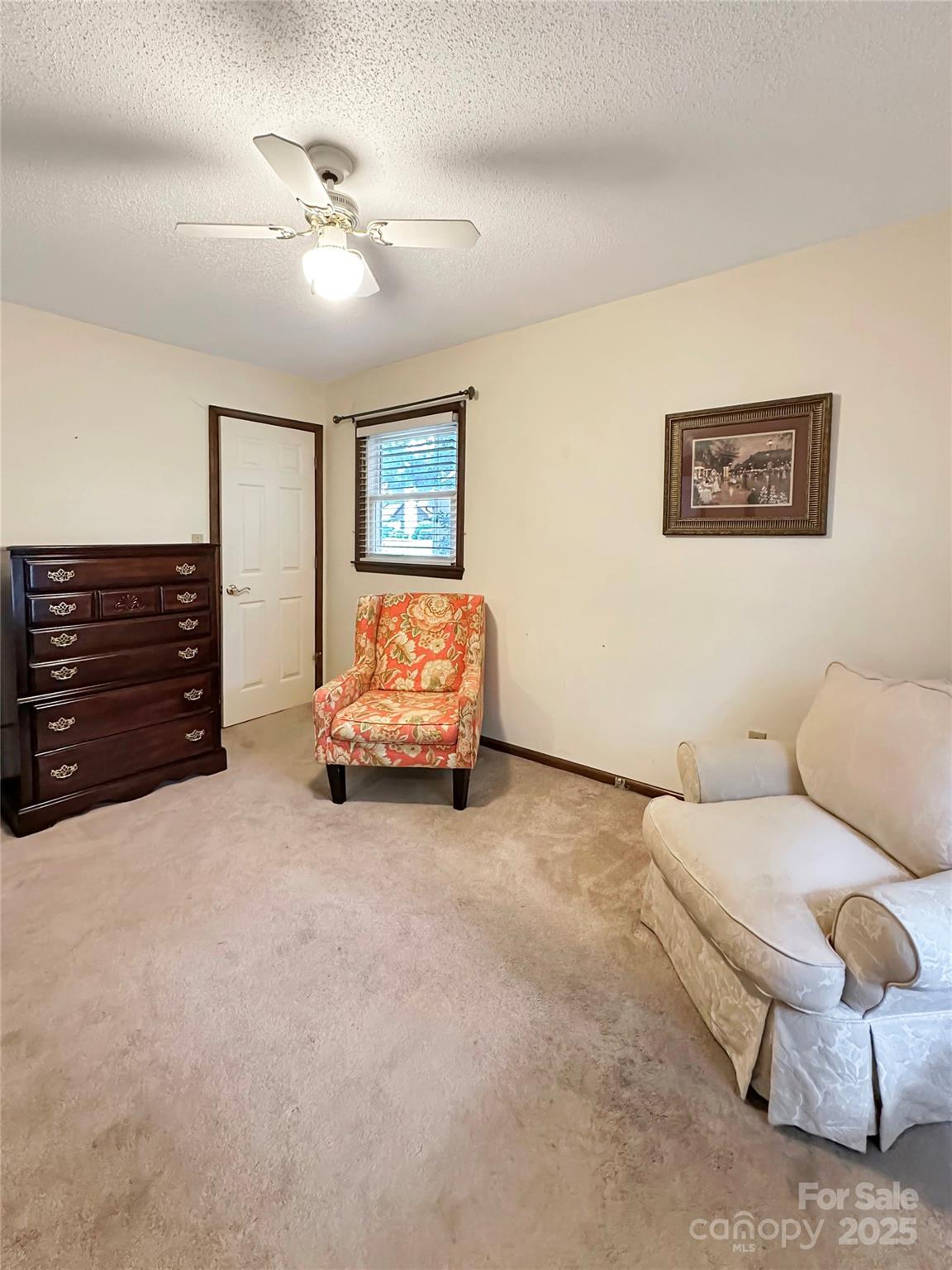 3245 15th Street Northeast Hickory, NC 28601 - Photo 24 of 39 a living room with furniture and a ceiling fan