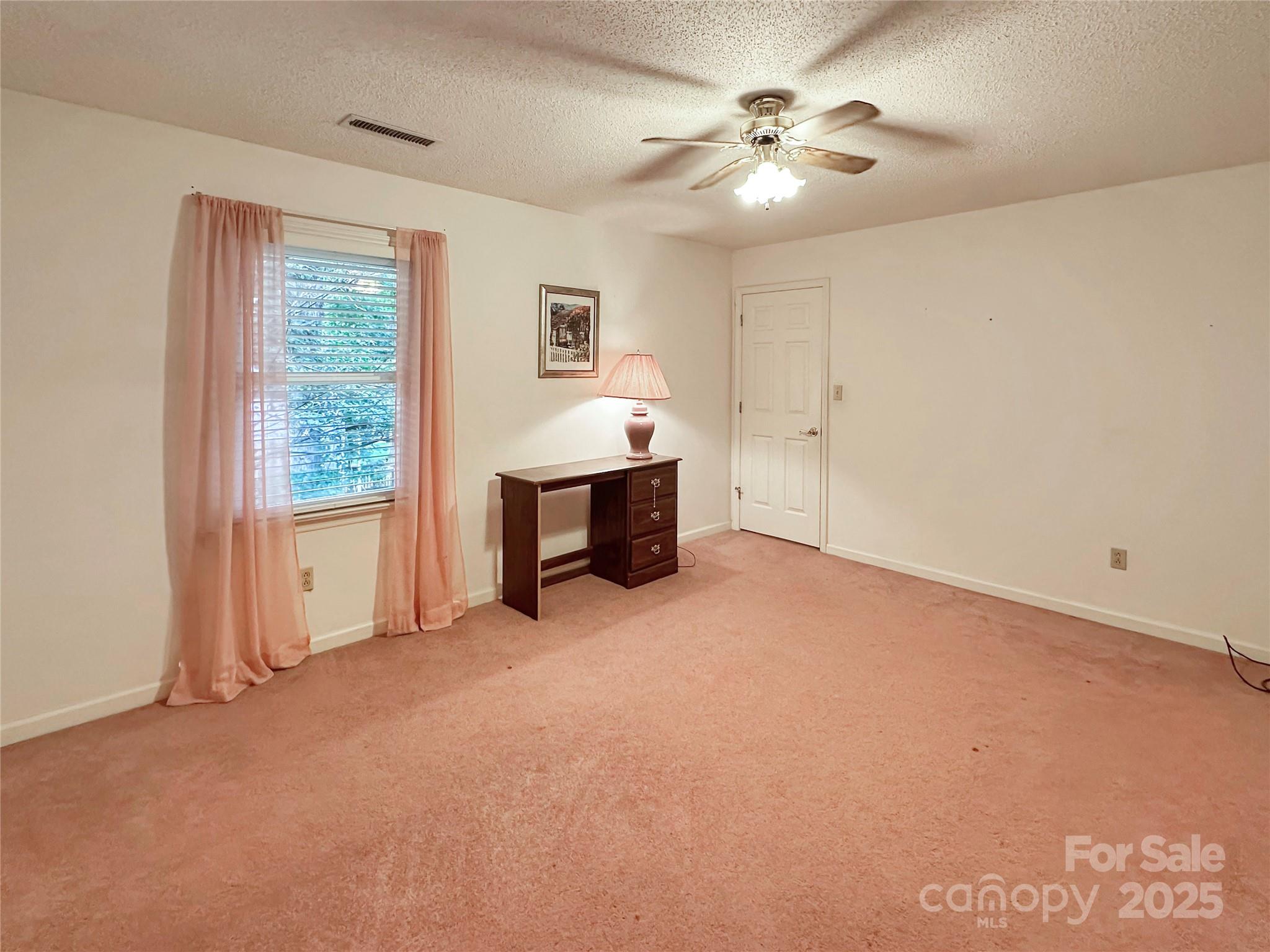3245 15th Street Northeast Hickory, NC 28601 - Photo 31 of 39 a view of a livingroom with a ceiling fan and window