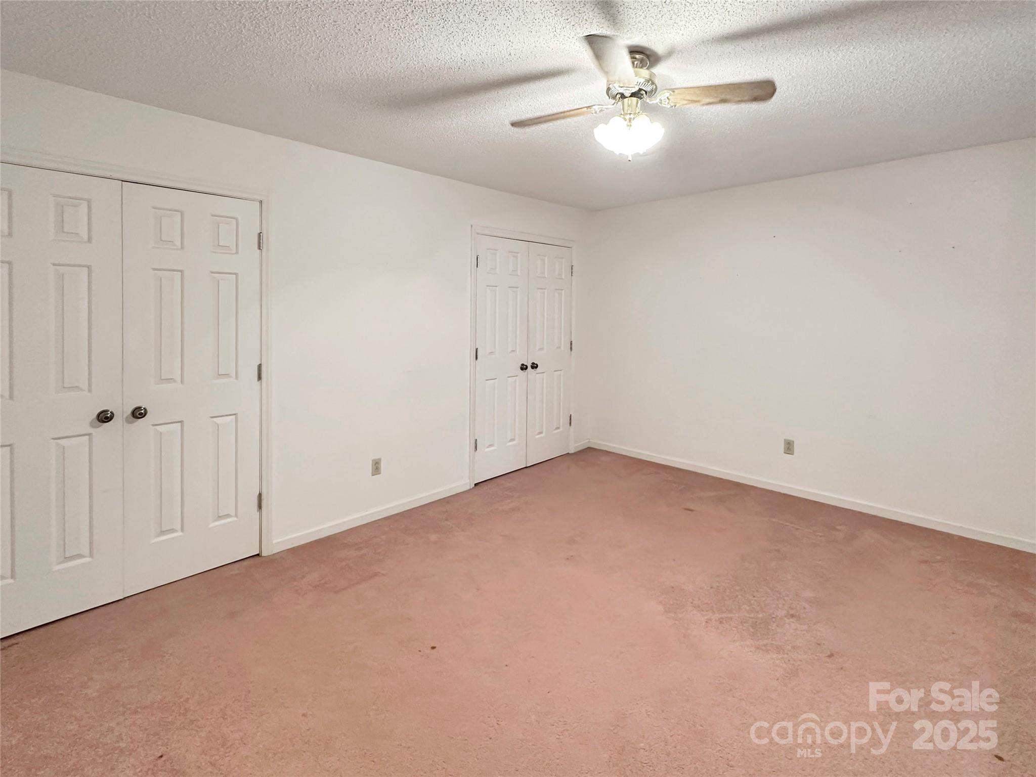 3245 15th Street Northeast Hickory, NC 28601 - Photo 32 of 39 an empty room with chandelier fan