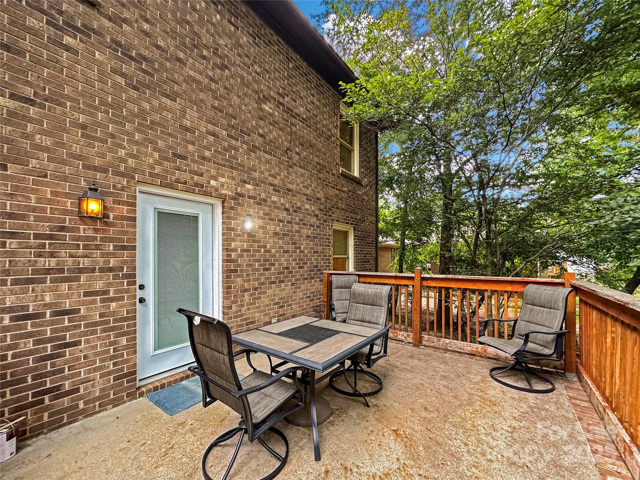 3245 15th Street Northeast Hickory, NC 28601 - Photo 35 of 39 a view of a patio with a table and chairs