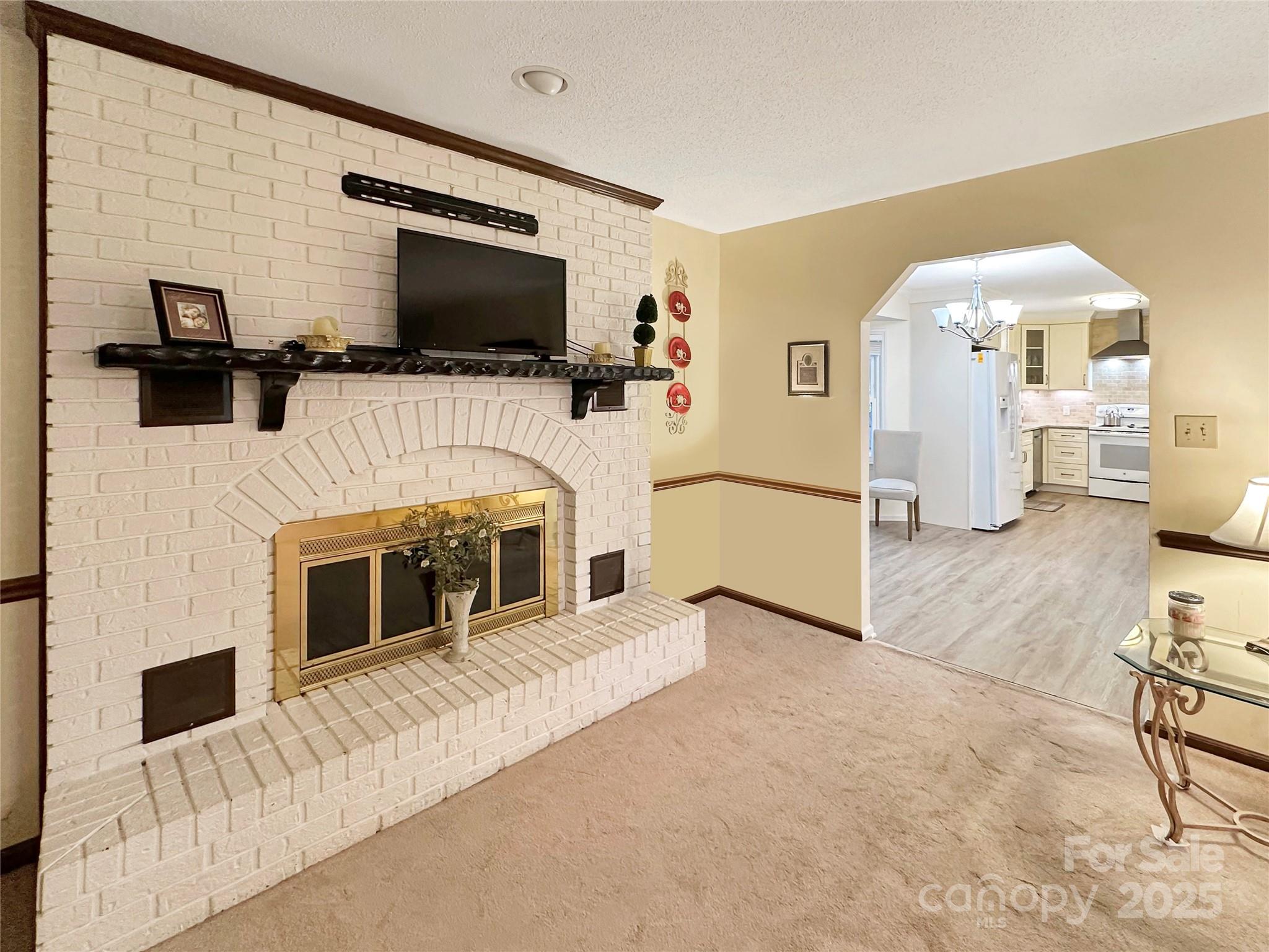 3245 15th Street Northeast Hickory, NC 28601 - Photo 5 of 39 a living room with furniture and a flat screen tv