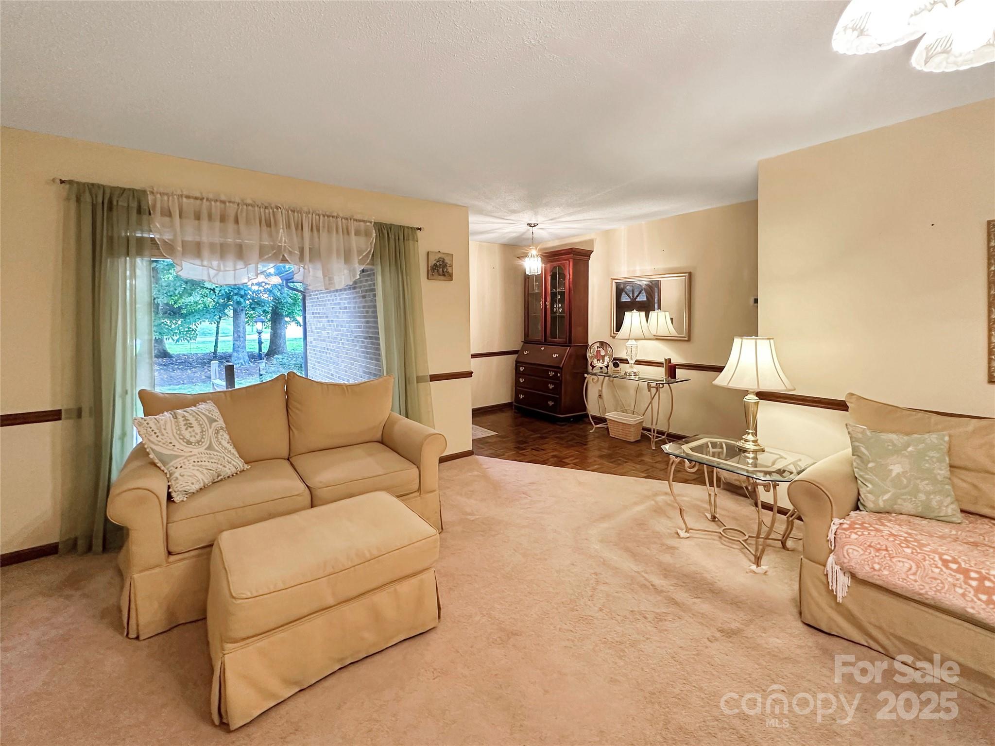 3245 15th Street Northeast Hickory, NC 28601 - Photo 6 of 39 a living room with furniture and a large window