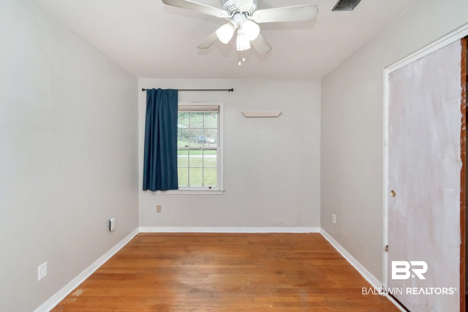 320 Vanderbilt Drive Mobile, AL 36608 - Photo 24 of 39 Spare room featuring ceiling fan and hardwood / wood-style floors