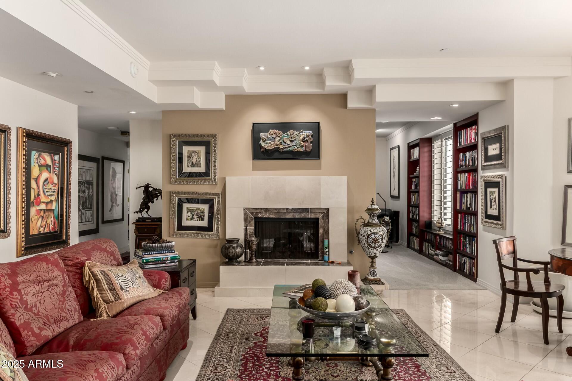 1040 East Osborn Road, Unit 1803 Phoenix, AZ 85014 - Photo 14 of 44 a living room with furniture and a fireplace