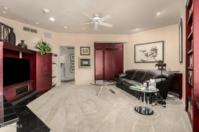 a living room with furniture and a large window