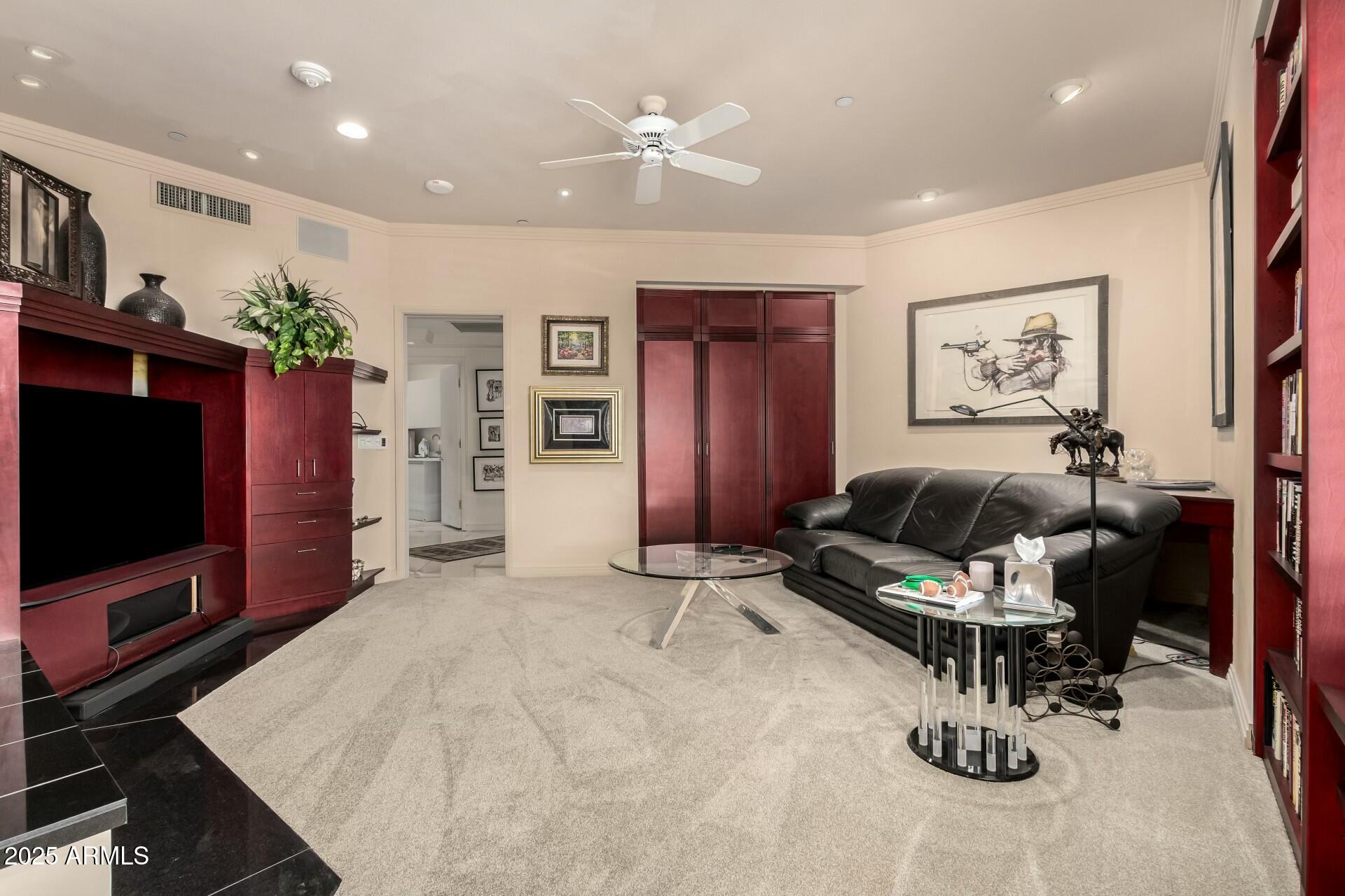 1040 East Osborn Road, Unit 1803 Phoenix, AZ 85014 - Photo 15 of 44 a living room with furniture and a flat screen tv