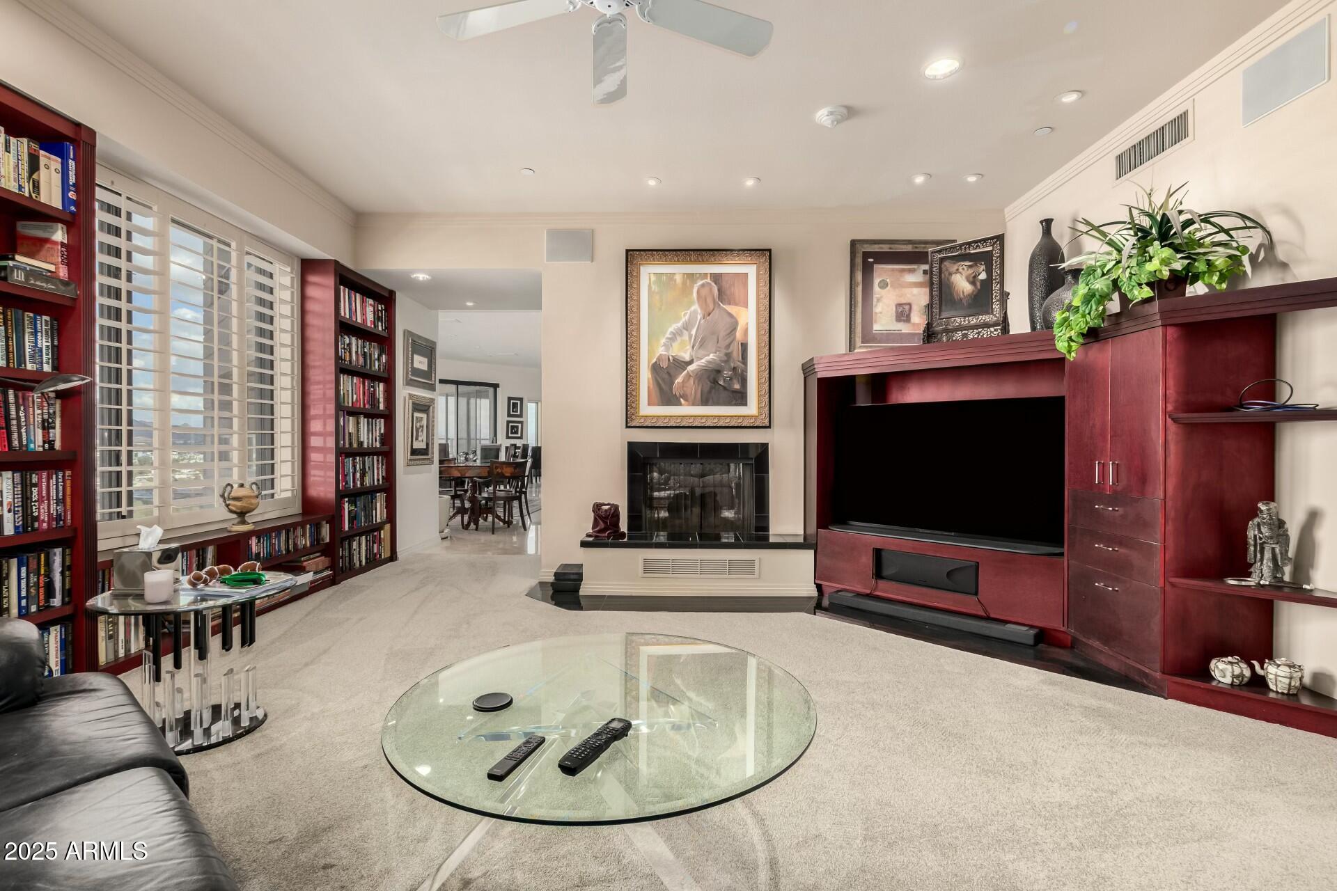 1040 East Osborn Road, Unit 1803 Phoenix, AZ 85014 - Photo 17 of 44 a living room with furniture and a flat screen tv