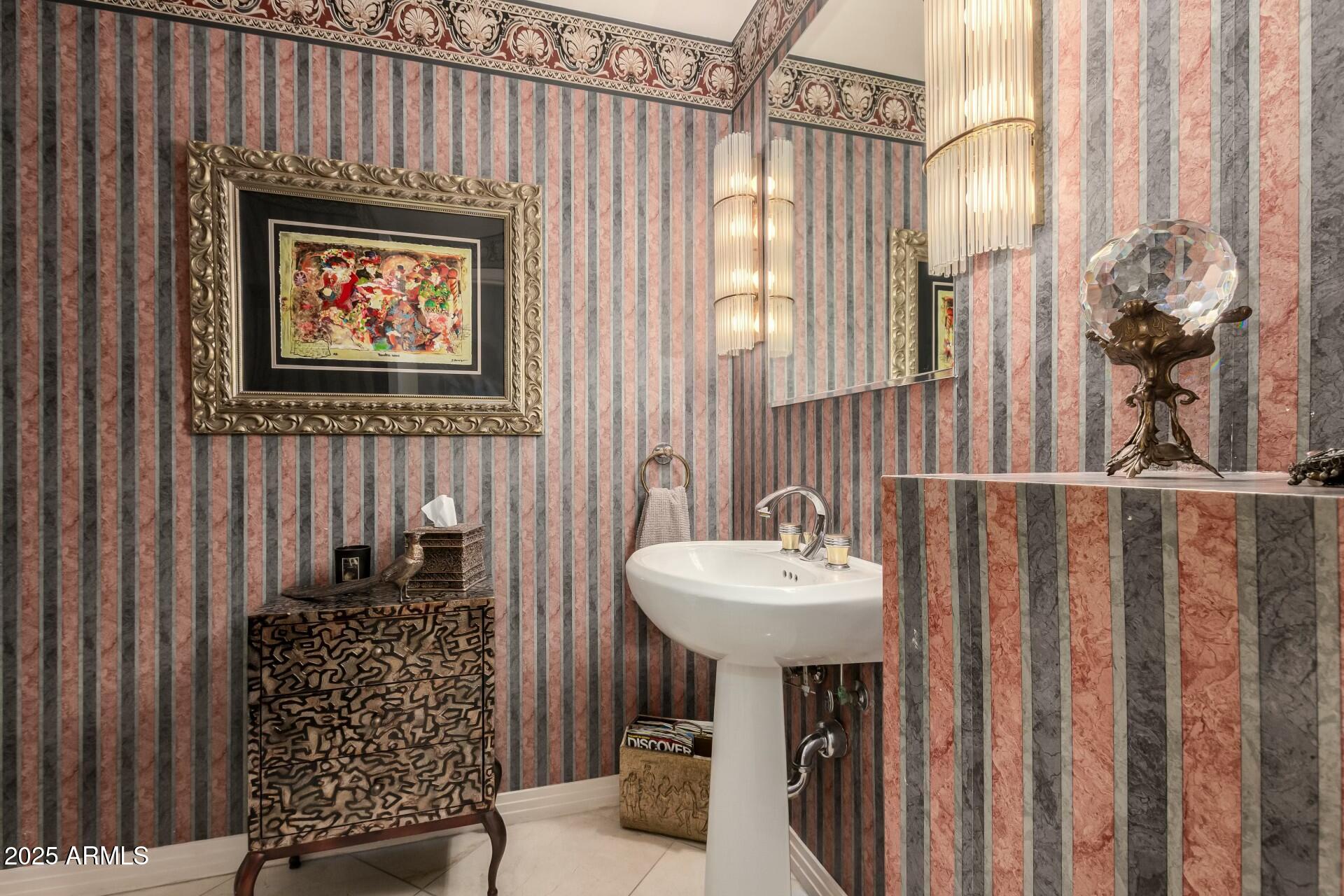 1040 East Osborn Road, Unit 1803 Phoenix, AZ 85014 - Photo 21 of 44 a bathroom with a sink a mirror and a shower